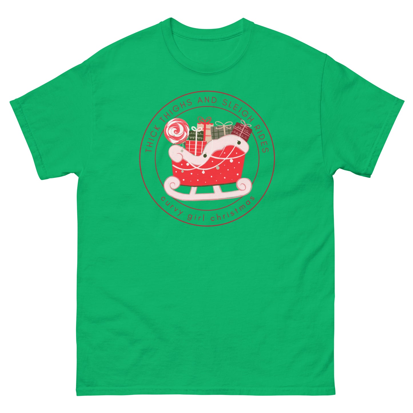 An irish green t-shirt with the Curvy Girl Christmas Sleigh Logo. The logo is a red fluffy sleigh filled with presents, with red lettering circling around that reads Thick Thighs and Sleigh Rides, as well as curvy Girl Christmas
