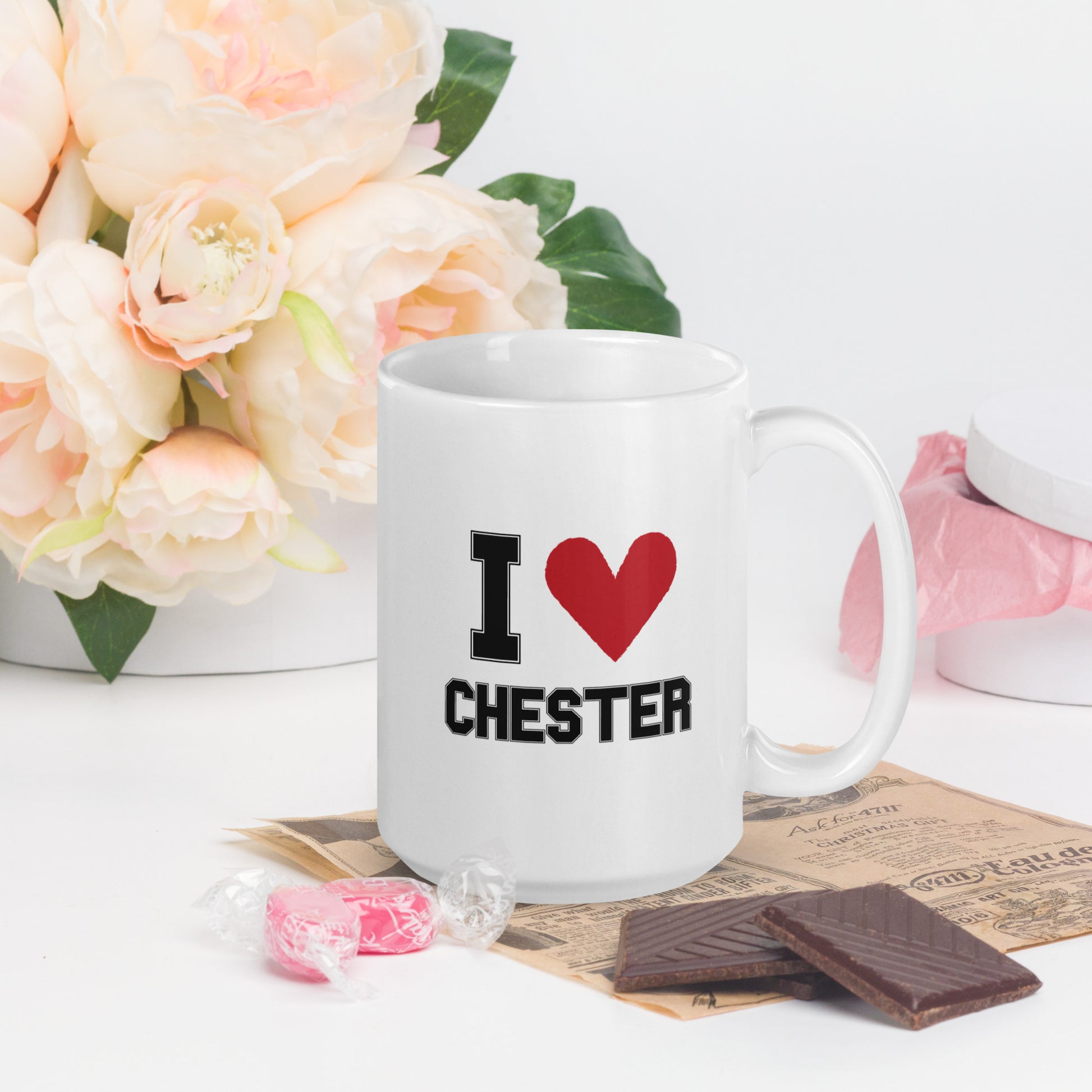 A white mug that  that reads "I Heart Chester" in black letters, with a large red heart 