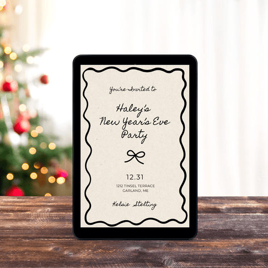 An ebook cover shows a party invitation that reads "You're Invited to Haley's New Years Eve Party, 12.31, 1712 Tensil Terrace Garland ME
Kelsie Stelting" the ebook sits on a table with a christmas tree in the background