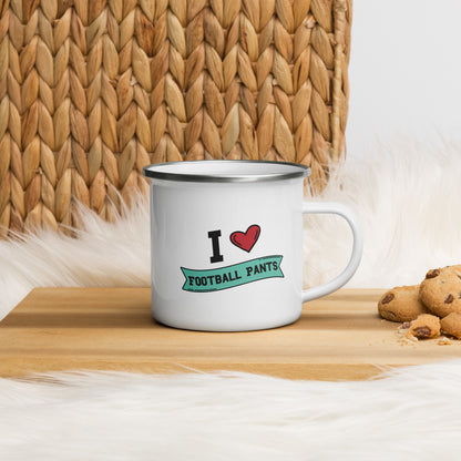 a white enamel mug  that reads "I Heart Football Pants", Football Pants is in a green banner and the design features a large red heart.