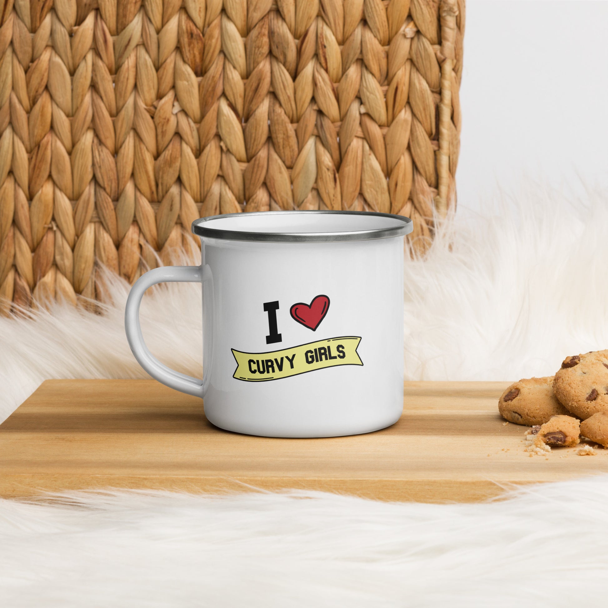 A white enamel coffee mug that reads "I Heart Curvy Girls", Curvy Girls is in a yellow banner and the design features a large red heart. 
