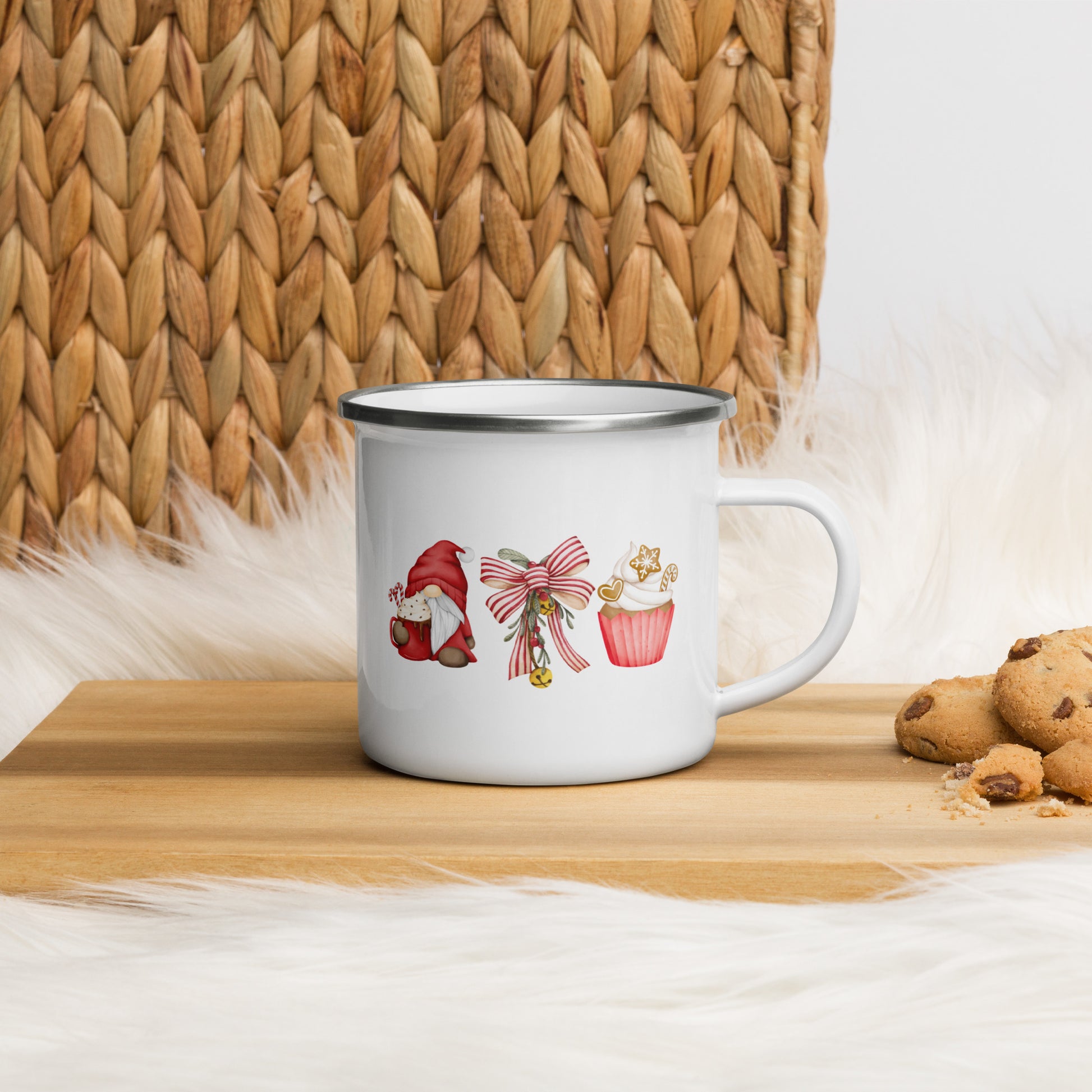 A white enamel mug with a garden gnome, a bow and a cupcake design
