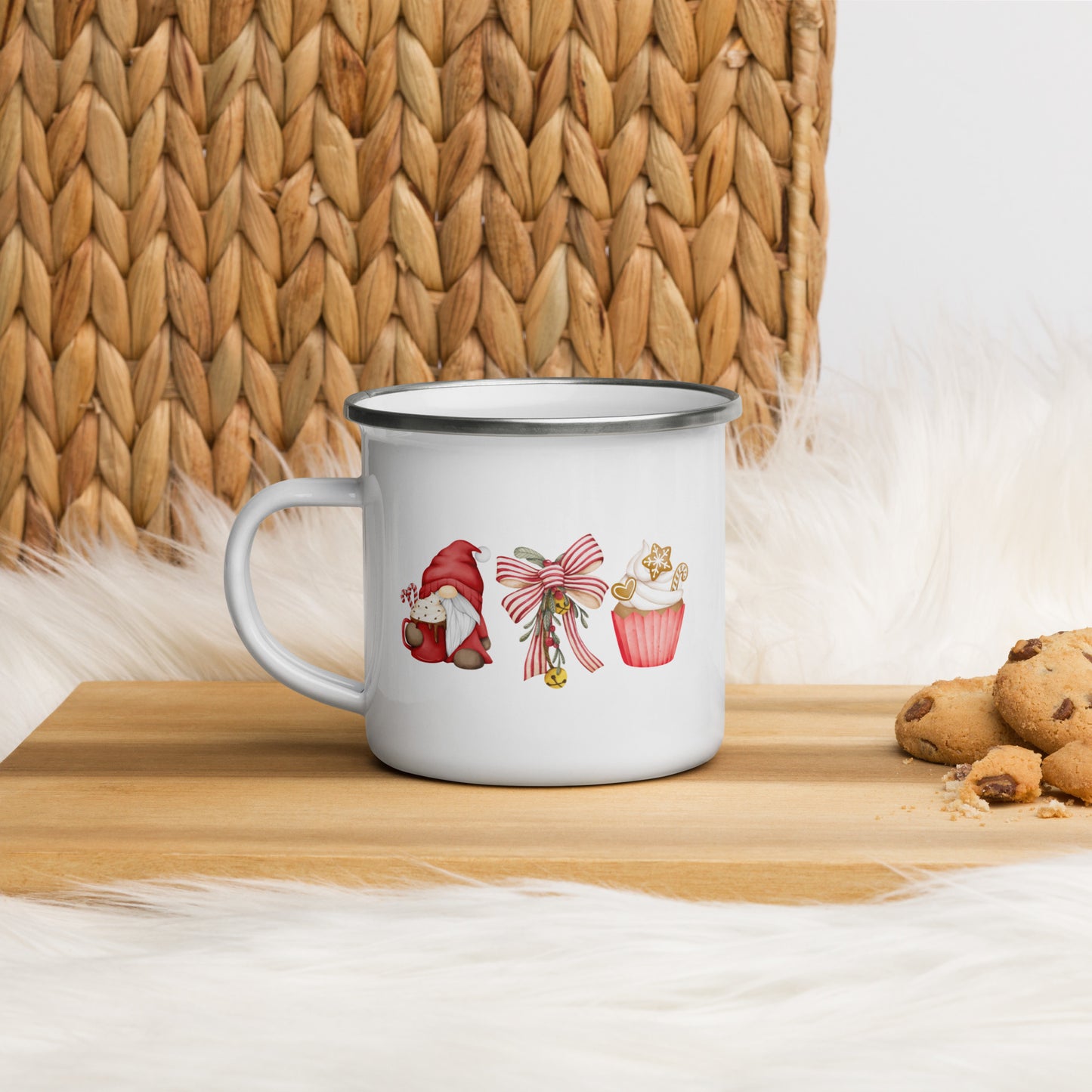 A white enamel mug with a garden gnome, a bow and a cupcake design
