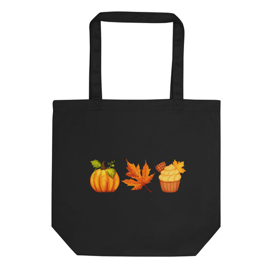 a black tote bag with orange pumpkin, leaf and cupcake design. 