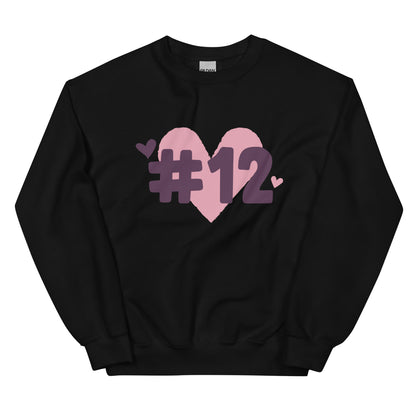 a black crewneck sweatshirt with the I Heart #12 Logo. The Number 12 Logo is a large pink heart with #12 in black written over the heart.