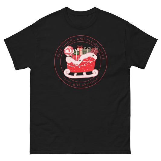 a black t-shirt with the Curvy Girl Christmas Sleigh Logo. The logo is a red fluffy sleigh filled with presents, with red lettering circling around that reads Thick Thighs and Sleigh Rides, as well as curvy Girl Christmas