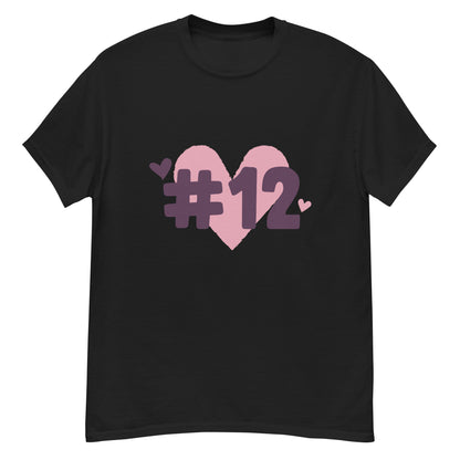 a black t-shirt with the I Heart #12 Logo. The Number 12 Logo is a large pink heart with #12 in black written over the heart.