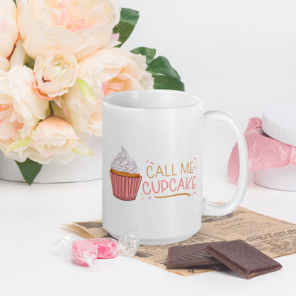 a white coffee mug with a cupcake logo and the words Call ME Cupcake