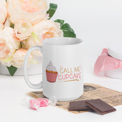 a white coffee mug with a cupcake logo and the words Call ME Cupcake