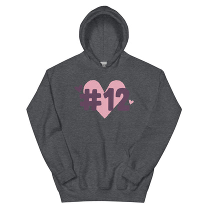 a dark heather hoodie with the I Heart #12 Logo. The Number 12 Logo is a large pink heart with #12 in black written over the heart.