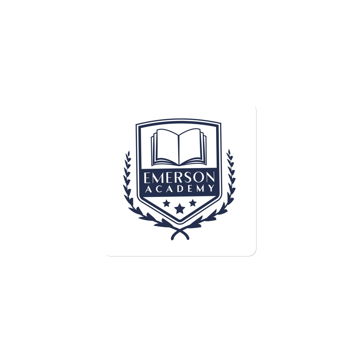 A magnet with the Emerson Academy Logo, a school crest that prominently features an open book