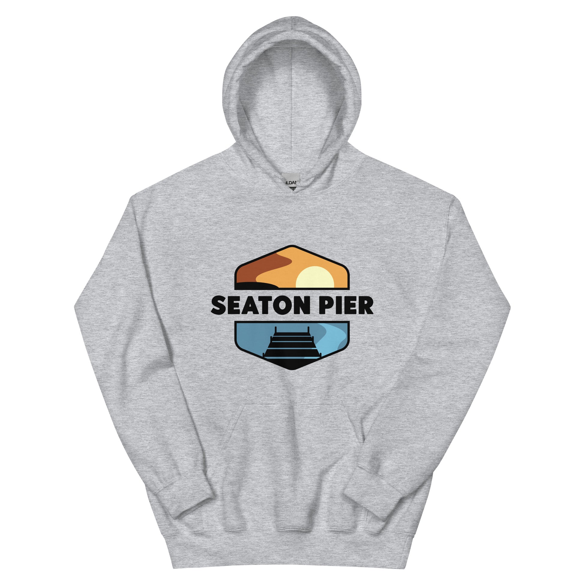 a grey hoodie with the Seaton Pier logo. The Seaton pier logo features the words Seaton Pier separating the sun and the ocean, with a dark pier on the water