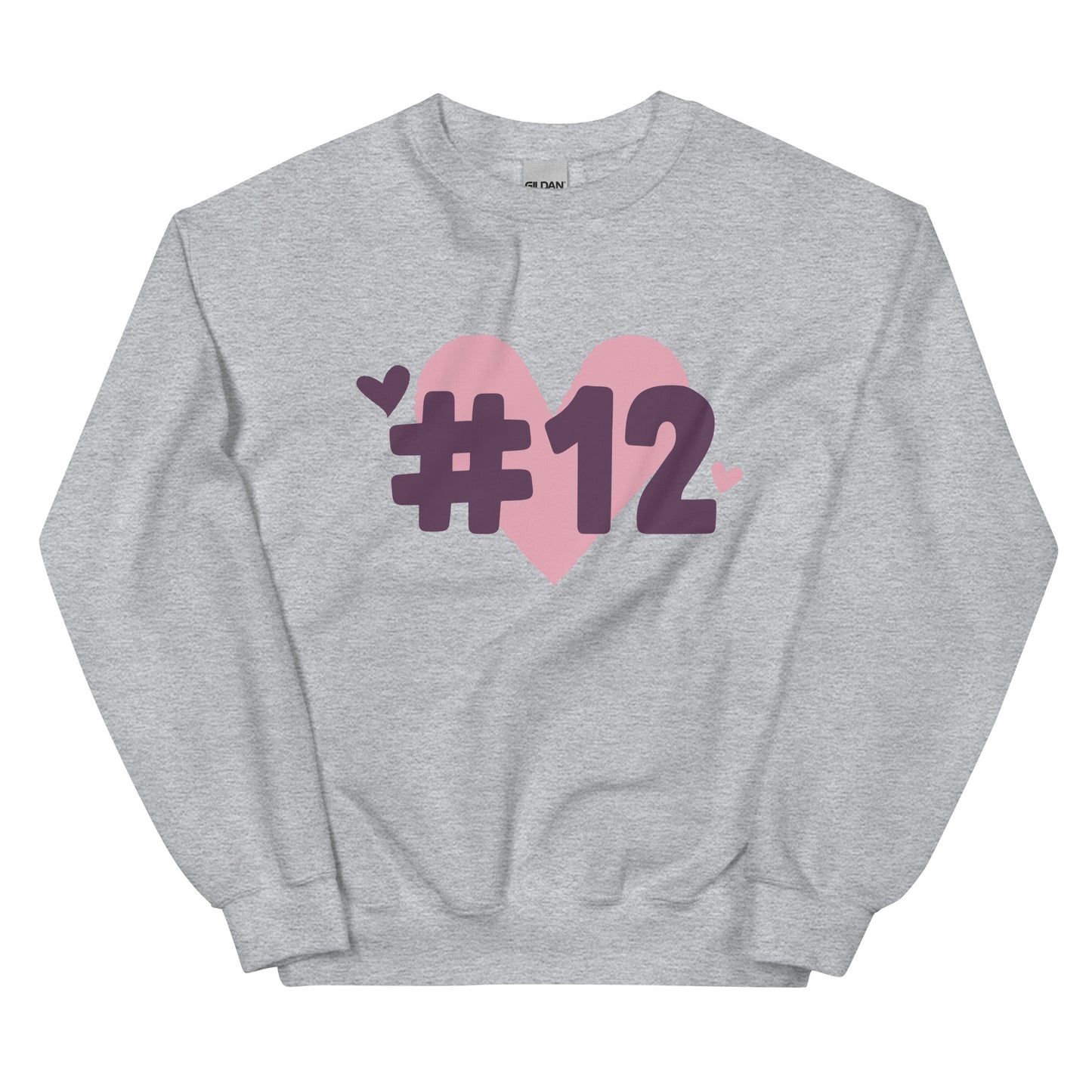 a grey crewneck sweatshirt with the I Heart #12 Logo. The Number 12 Logo is a large pink heart with #12 in black written over the heart.