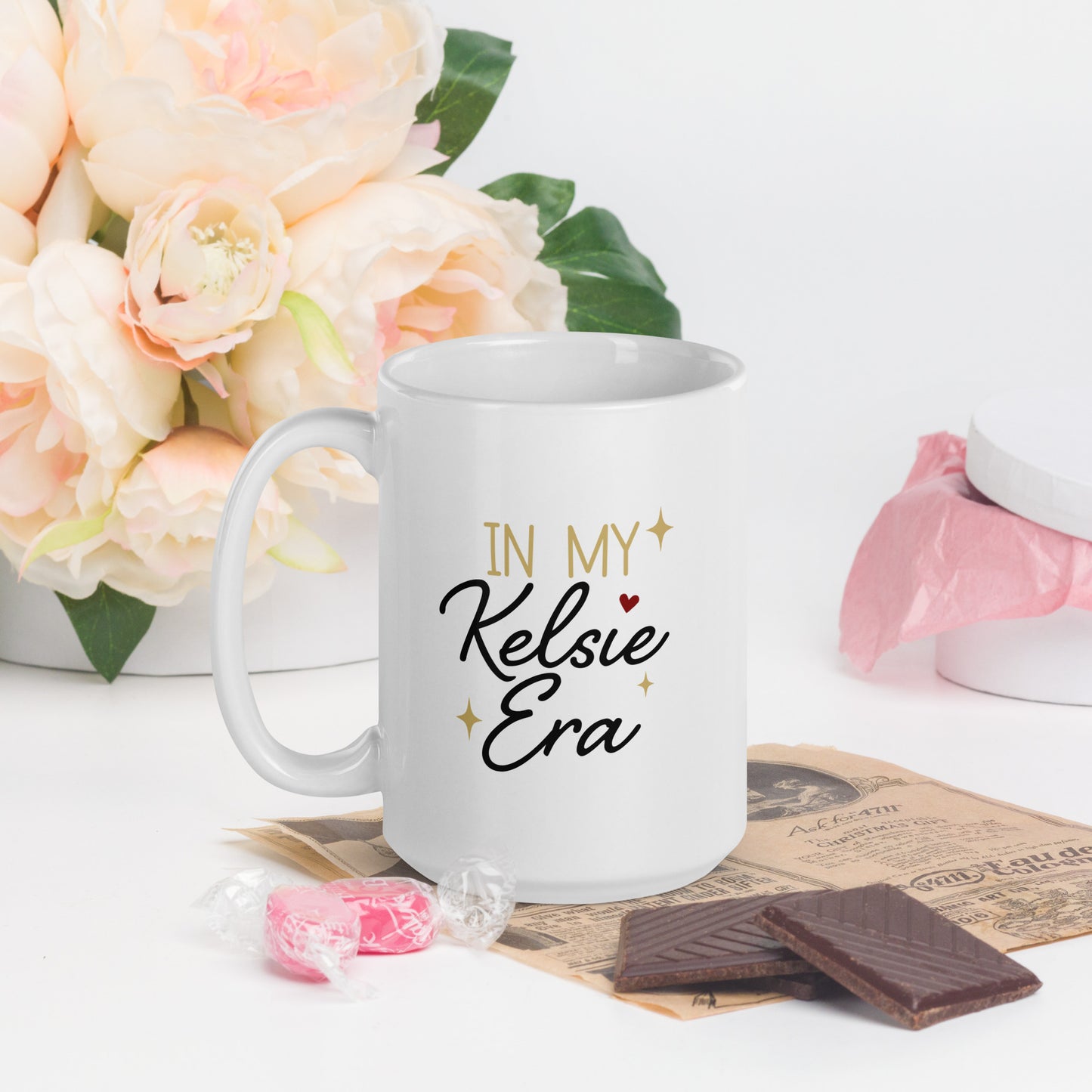 In My Kelsie Era, written in black and gold lettering on a white coffee mug 