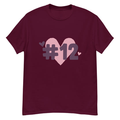 a maroon t-shirt with the I Heart #12 Logo. The Number 12 Logo is a large pink heart with #12 in black written over the heart.