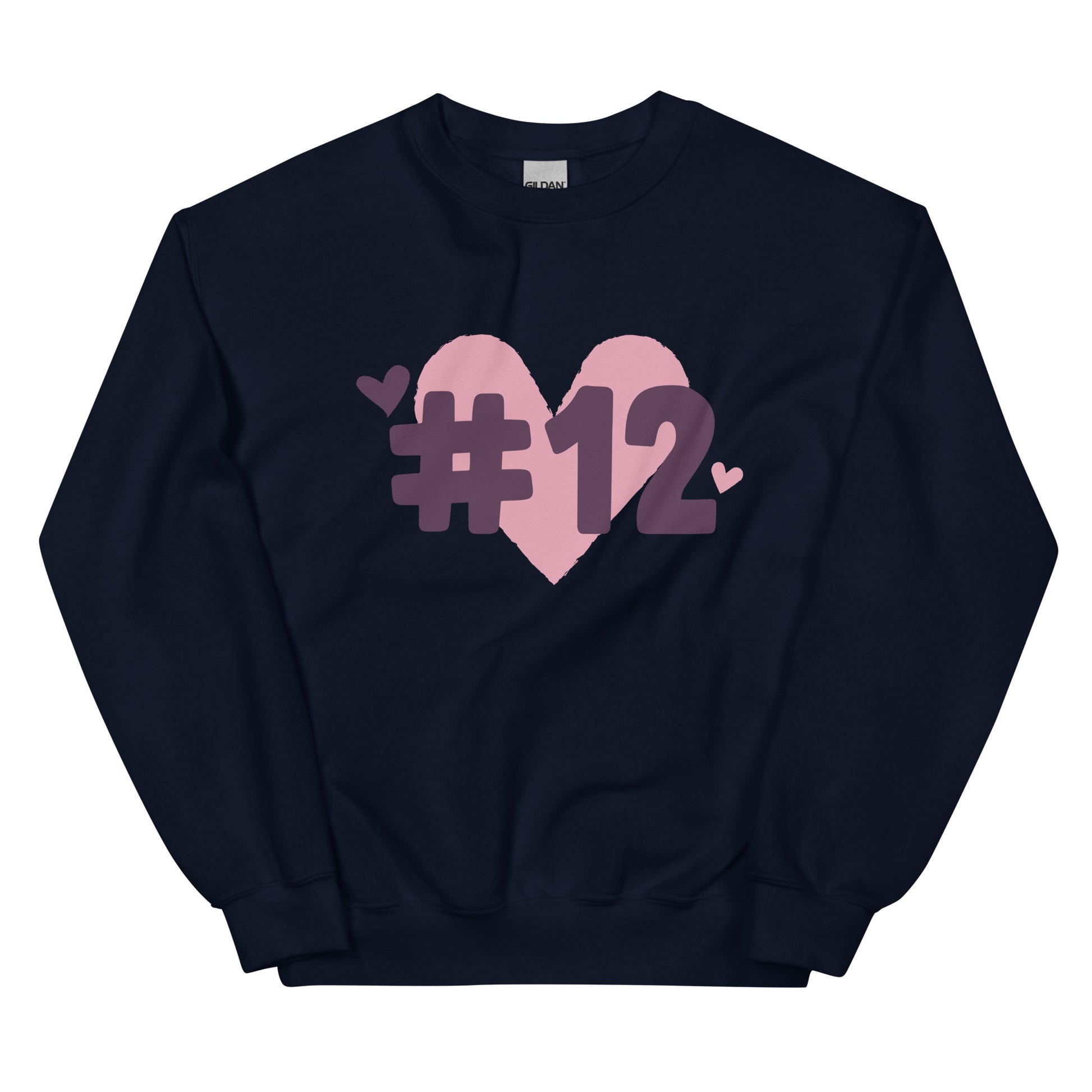 a navy crewneck sweatshirt with the I Heart #12 Logo. The Number 12 Logo is a large pink heart with #12 in black written over the heart.