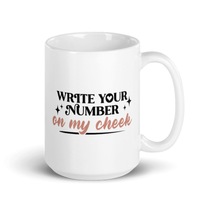 A white coffee mug that reads "Write Your Number" in black print and "On my cheek" in golden cursive lettering