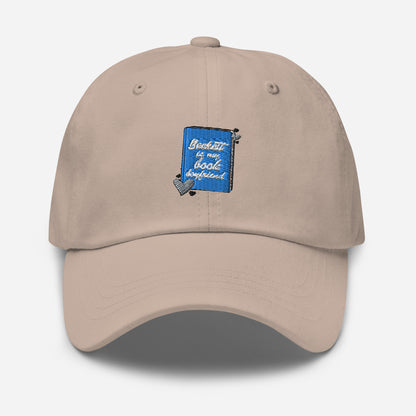 a stone colored with the Beckett logo. The Beckett Logo is a blue book with the words Beckett is my book Boyfriend in cursive, with hearts around the book. 