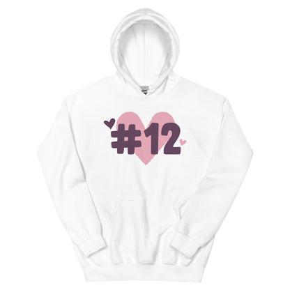 a white hoodie with the I Heart #12 Logo. The Number 12 Logo is a large pink heart with #12 in black written over the heart.