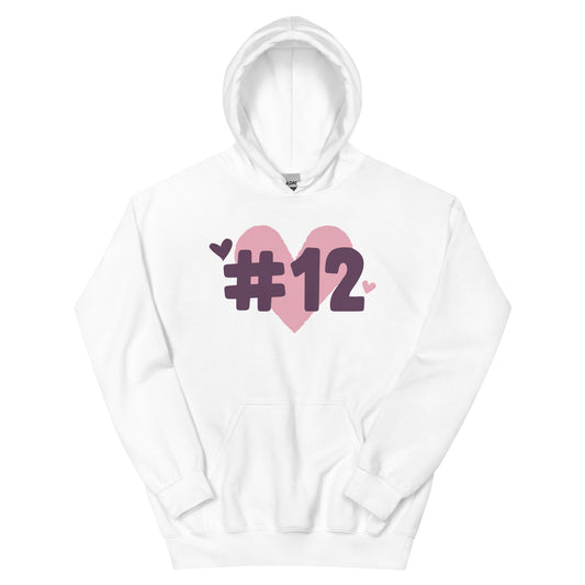 a white hoodie with the I Heart #12 Logo. The Number 12 Logo is a large pink heart with #12 in black written over the heart.