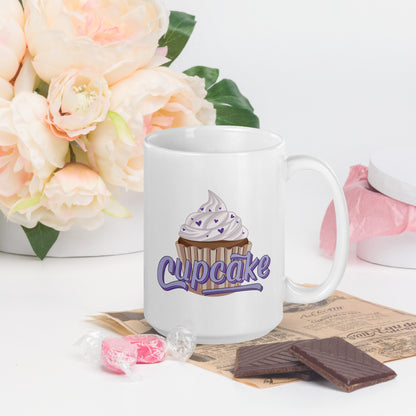 a glossy white mug with a cupcake logo. The cupcake logo is a large cupcake covered in sprinkles, with cupcake written over it in pink block letters