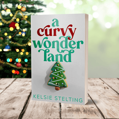a paperback copy of a curvy wonderland by Kelsie Stelting 