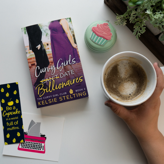 Several stickers surround a book cover titled "Curvy Girls Can't Date Billionaires" The Curvy Girl Club Book 2
Kelsie Stelting