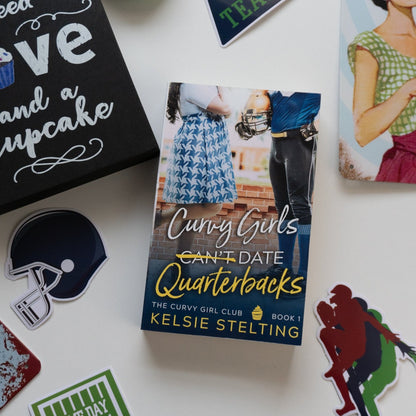 Several stickers surround a book cover titled "Curvy Girls Can't Date Quarterbacks" The Curvy Girl Club Book 1 
Kelsie Stelting